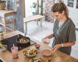 A woman is preparing food on the table