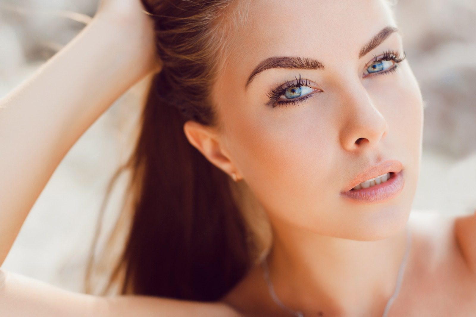 A woman with blue eyes and long hair.