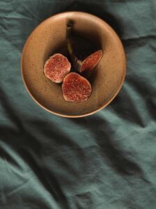 A bowl of figs on the table