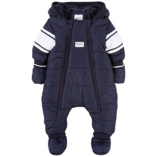 A baby is wearing a snowsuit with an attached hood.