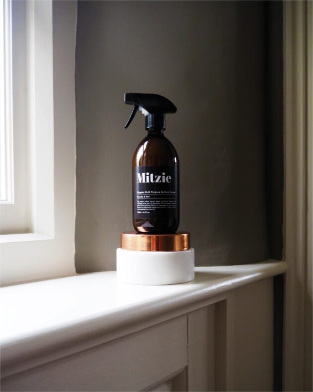 A spray bottle sitting on top of a counter.