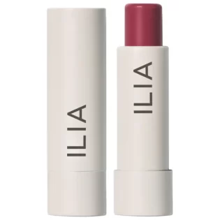 A tube of lipstick is shown next to the box.