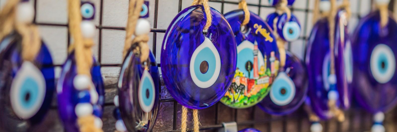 A close up of some blue evil eye decorations