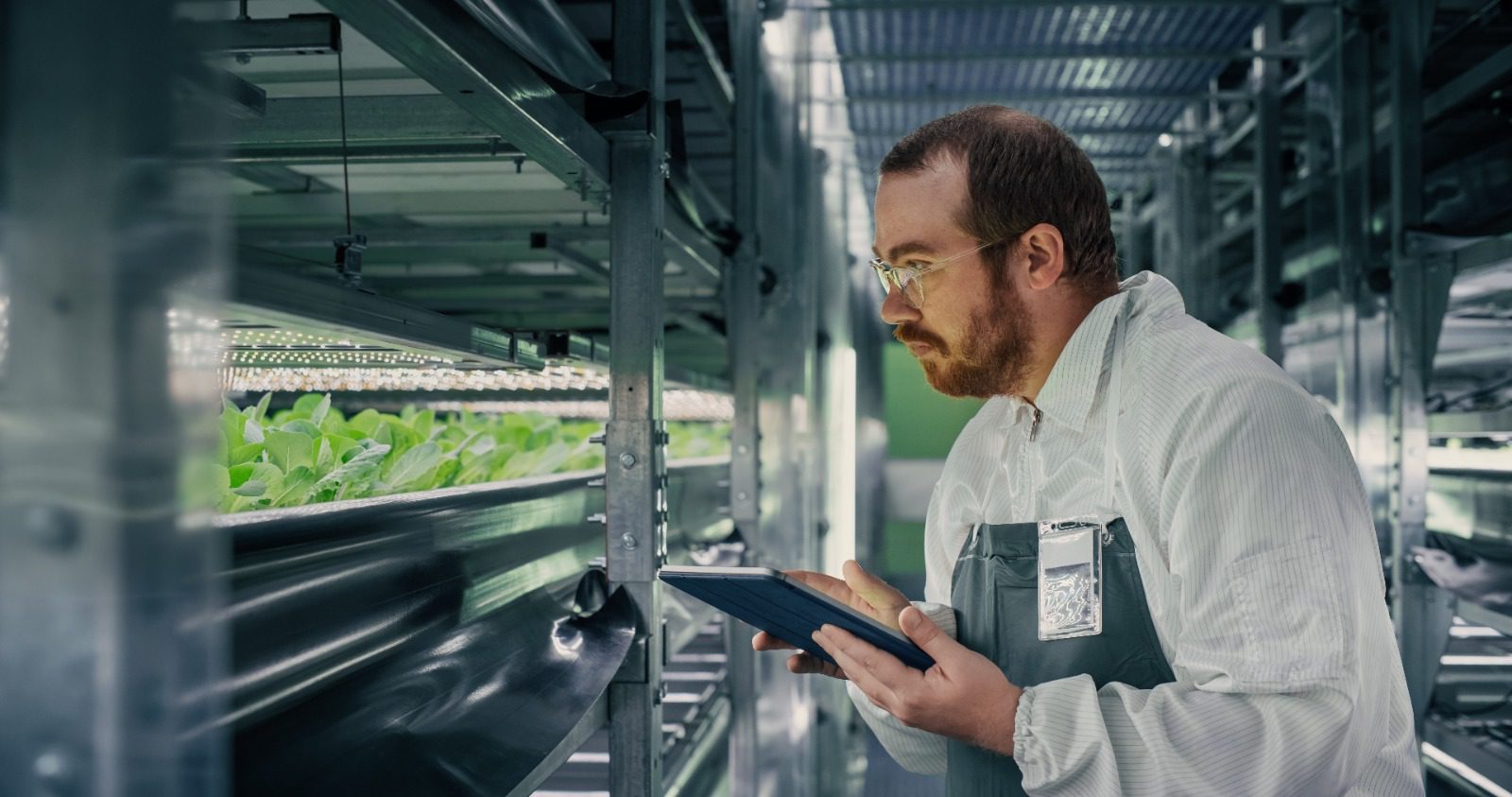 A man holding an ipad in his hands.